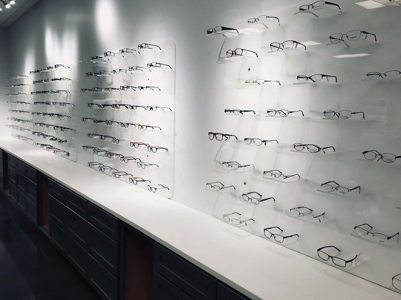 One of the many walls of eyeglasses available at Looking Glass Vision